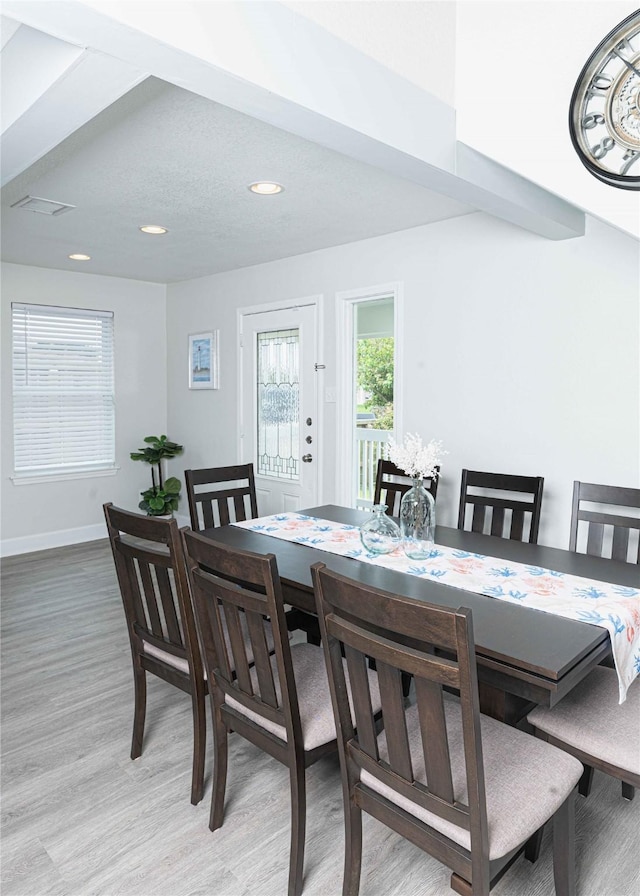 dining area with visible vents, baseboards, wood finished floors, and recessed lighting