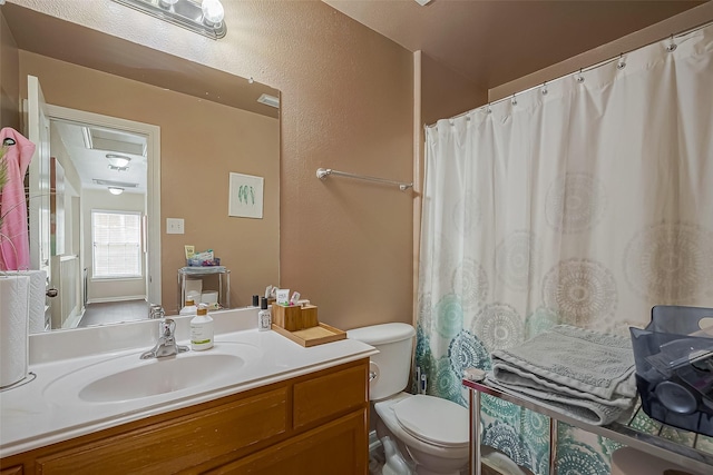 full bathroom with vanity, toilet, and a shower with curtain