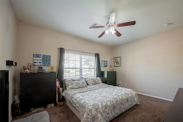 bedroom featuring a ceiling fan, visible vents, dark carpet, and baseboards