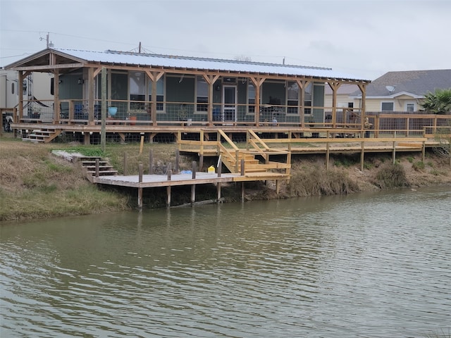 back of property with a water view