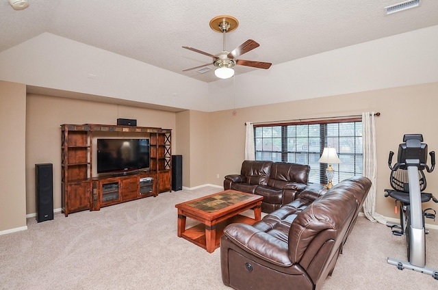 living area with lofted ceiling, a ceiling fan, visible vents, and light colored carpet