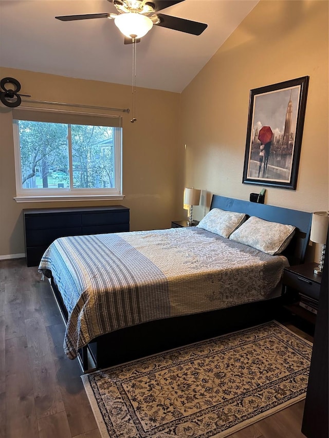 bedroom featuring vaulted ceiling, ceiling fan, dark wood-style floors, and baseboards