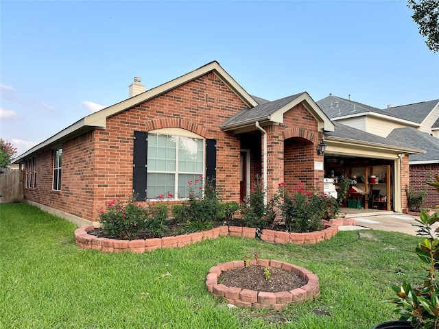 ranch-style house featuring a front lawn, brick siding, an attached garage, and roof with shingles