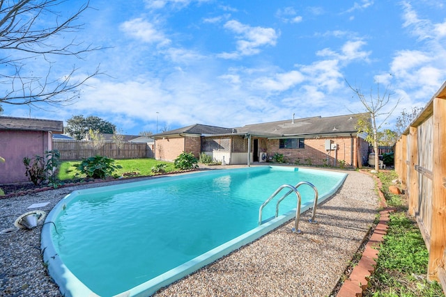 view of swimming pool with a fenced in pool and a fenced backyard