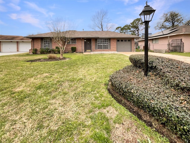 ranch-style home with a garage, a front yard, brick siding, and driveway