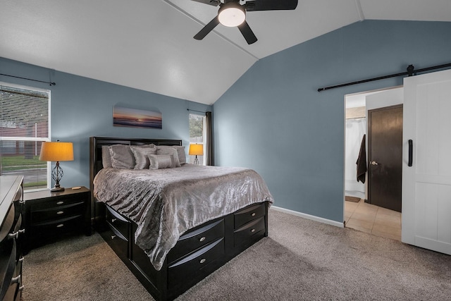 bedroom featuring carpet, lofted ceiling, a barn door, a ceiling fan, and baseboards