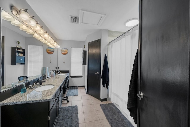 full bath with double vanity, tile patterned flooring, visible vents, and a sink