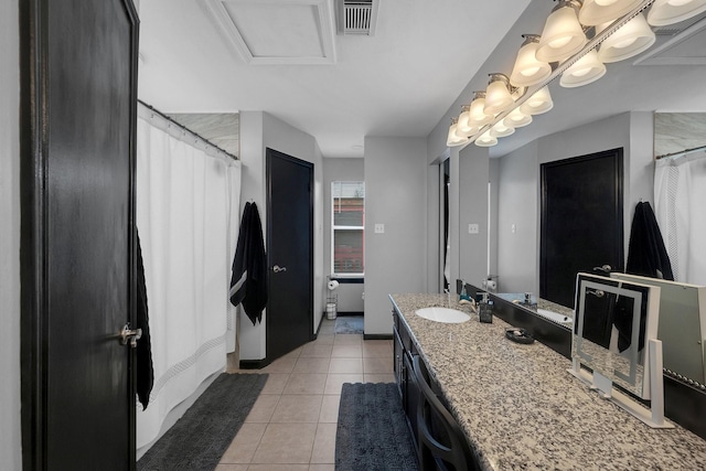 bathroom with visible vents, vanity, a shower with shower curtain, and tile patterned floors