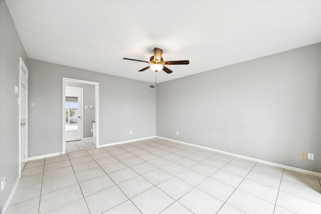 unfurnished room featuring visible vents, ceiling fan, baseboards, and light tile patterned flooring