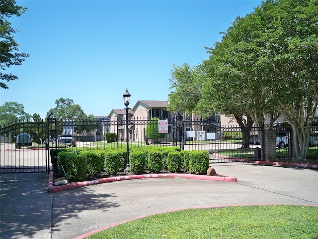 view of gate featuring fence