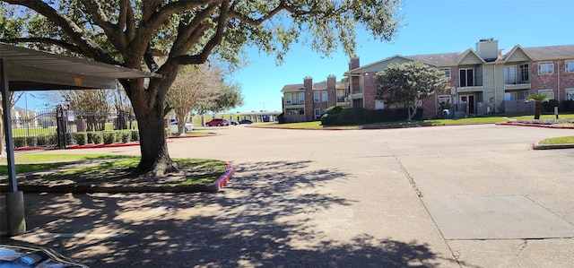 view of street with a residential view and curbs