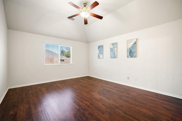 unfurnished room with lofted ceiling, dark wood-style flooring, ceiling fan, and baseboards