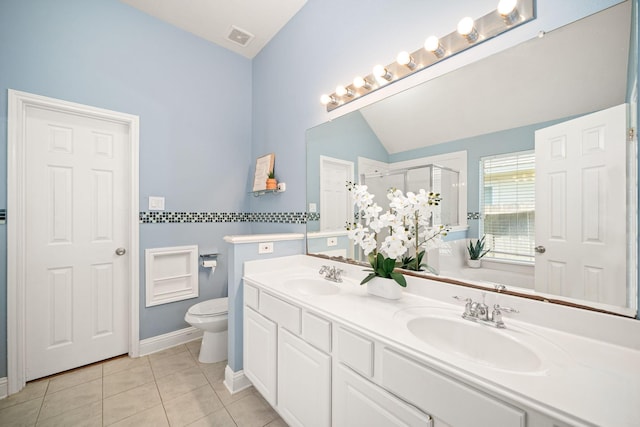 full bath featuring a stall shower, a sink, visible vents, and tile patterned floors