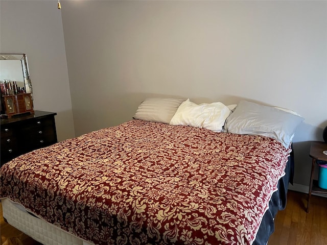 bedroom with wood finished floors