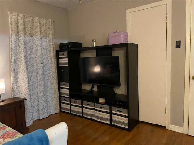 bedroom featuring wood finished floors