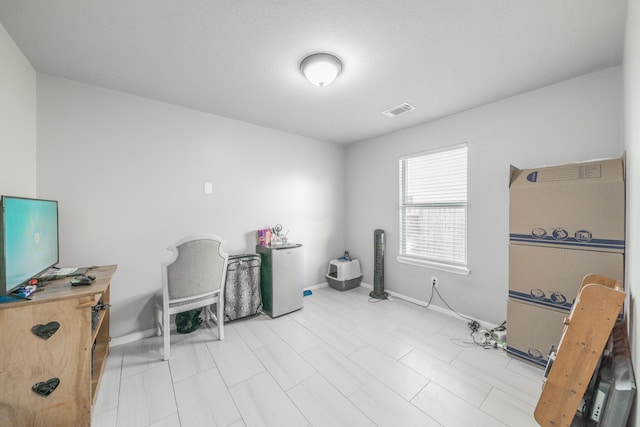 interior space featuring visible vents and baseboards