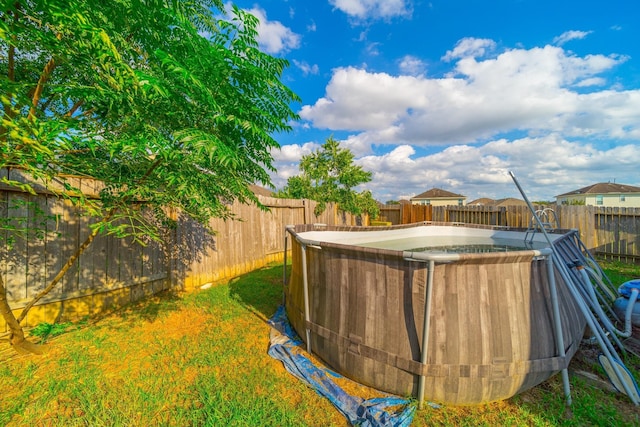 view of yard with a fenced backyard and a fenced in pool