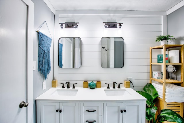 bathroom featuring double vanity and a sink