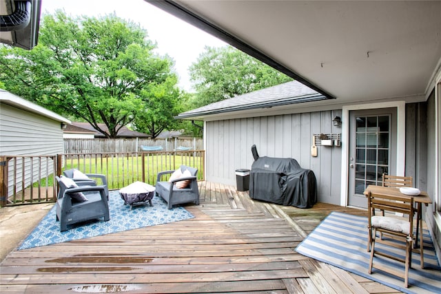 wooden terrace with fence and area for grilling