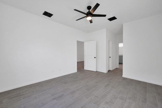 unfurnished bedroom featuring visible vents, ceiling fan, light wood-style flooring, and baseboards