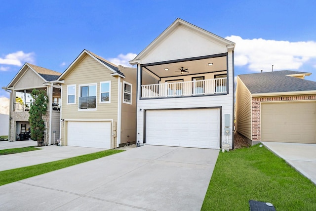 view of front of house featuring a balcony, an attached garage, concrete driveway, and a front yard