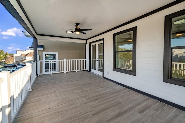 wooden deck with a ceiling fan and a porch