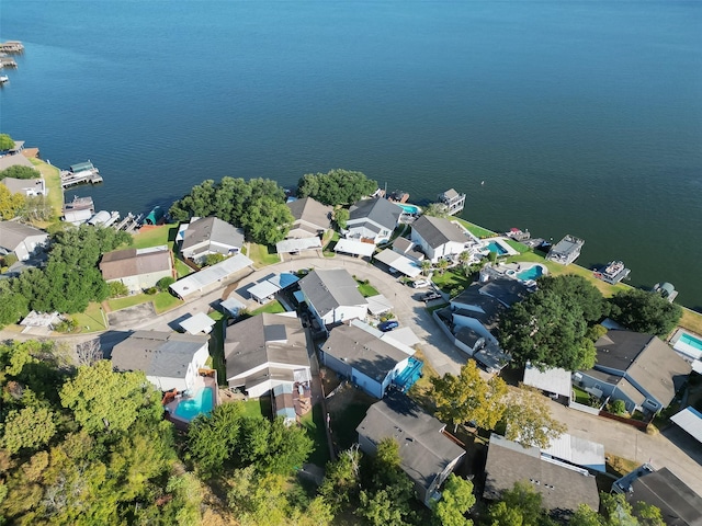 bird's eye view featuring a water view and a residential view