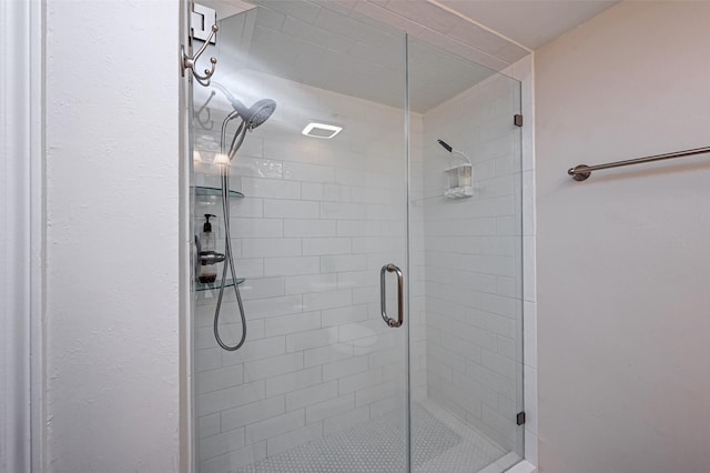 bathroom featuring a shower stall