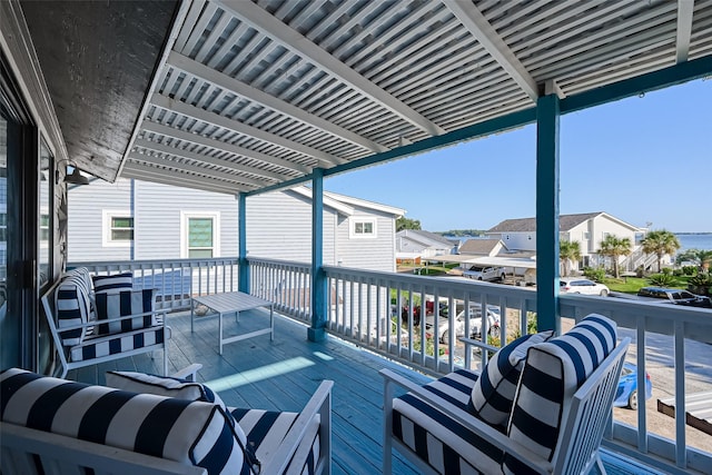 wooden deck featuring a residential view and a pergola