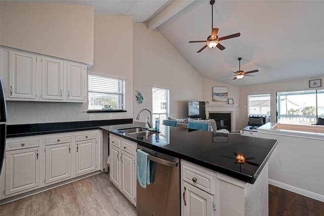 kitchen featuring open floor plan, dark countertops, and white cabinets