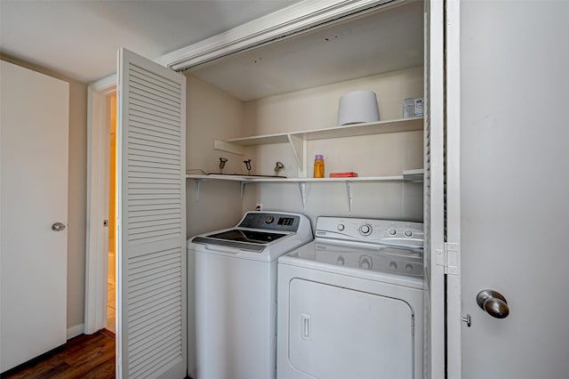 laundry room featuring washer and dryer, laundry area, and dark wood-style flooring