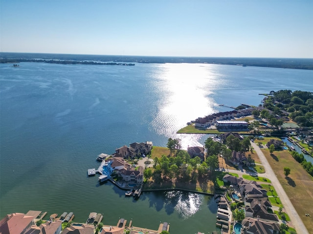 drone / aerial view with a water view and a residential view