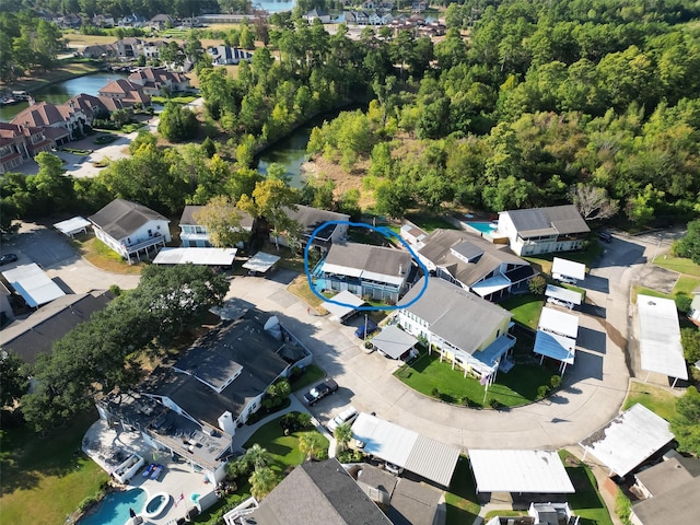 bird's eye view featuring a residential view and a water view