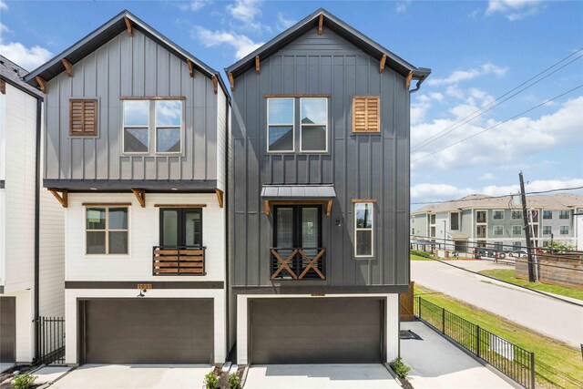 1931 Johanna Dr, Houston, TX 77055 - view of front of house featuring board and batten siding, a garage, and concrete driveway