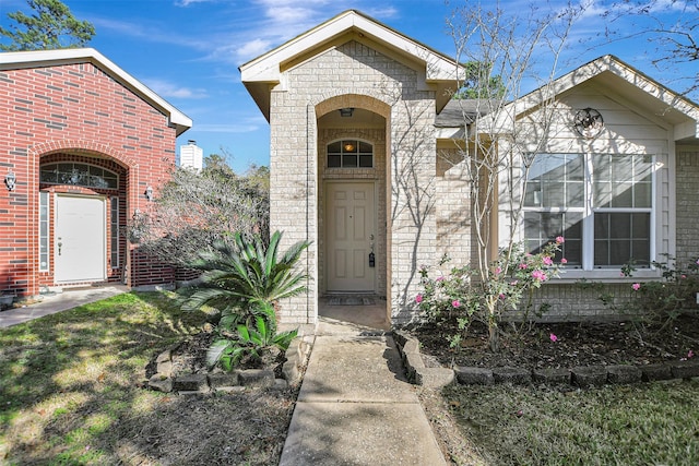 property entrance with brick siding