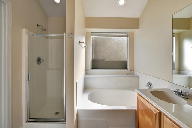 bathroom featuring recessed lighting, a garden tub, a shower stall, and vanity