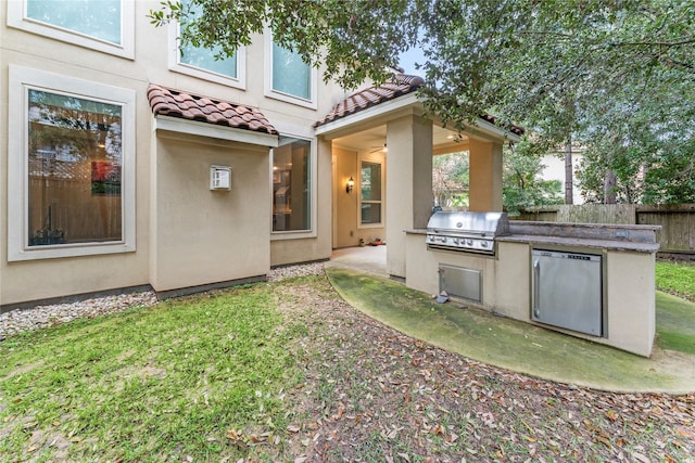 view of yard featuring a patio, area for grilling, and fence