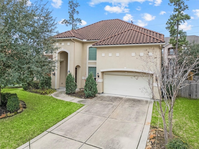 mediterranean / spanish home with driveway, a front yard, a tile roof, and stucco siding