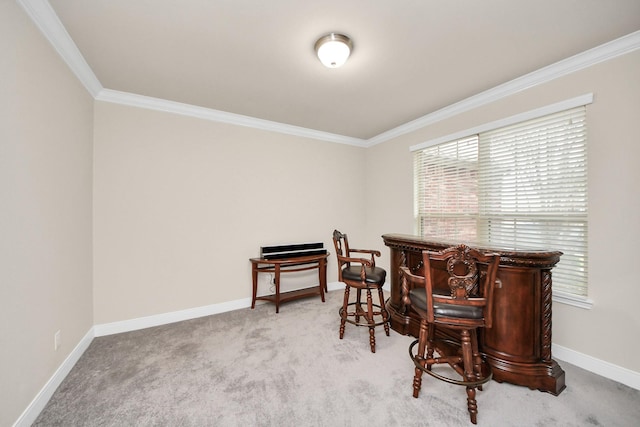 office featuring baseboards, ornamental molding, and light colored carpet