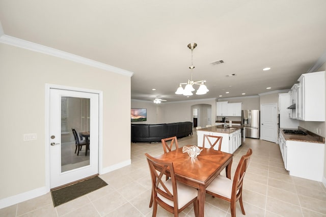 dining room with baseboards, ornamental molding, visible vents, and recessed lighting