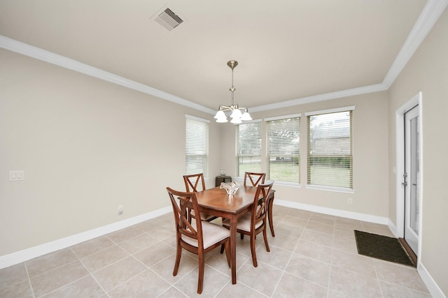 dining room featuring a notable chandelier, light tile patterned floors, visible vents, ornamental molding, and baseboards