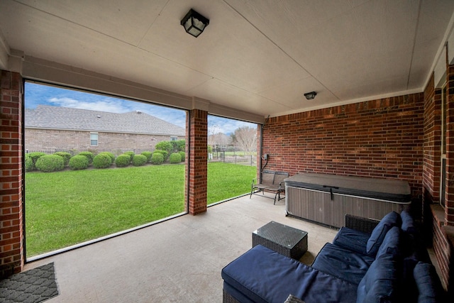 view of patio / terrace featuring outdoor lounge area, fence, and a hot tub