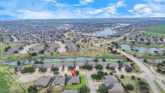 aerial view featuring a water view and a residential view