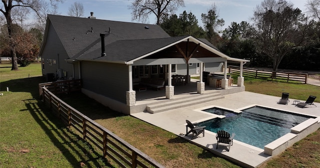 back of house with a fenced in pool, roof with shingles, fence, a yard, and a patio area