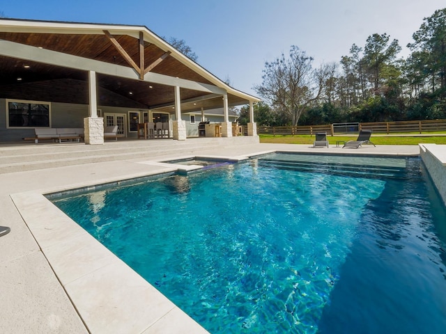 view of swimming pool with a fenced in pool, a patio area, and fence