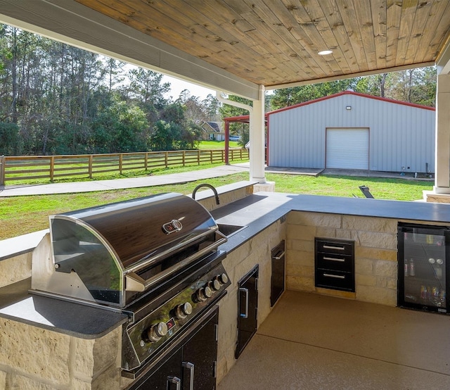 view of patio / terrace featuring wine cooler, fence, and area for grilling