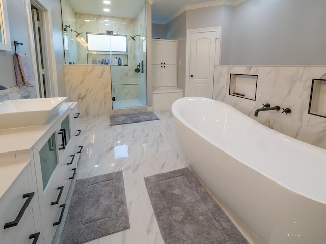 full bath featuring vanity, a freestanding bath, marble finish floor, a marble finish shower, and crown molding