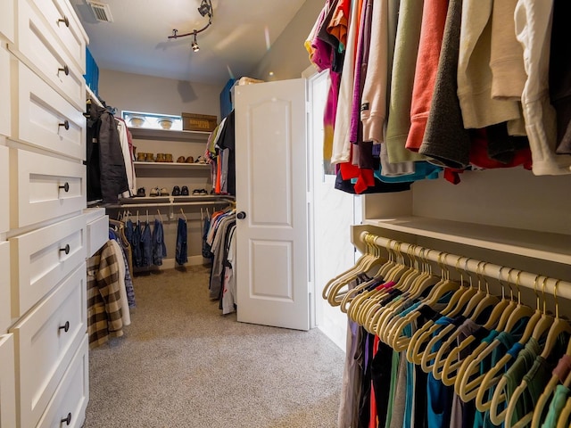 spacious closet featuring light carpet and visible vents