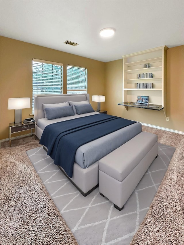 bedroom featuring carpet flooring, visible vents, and baseboards