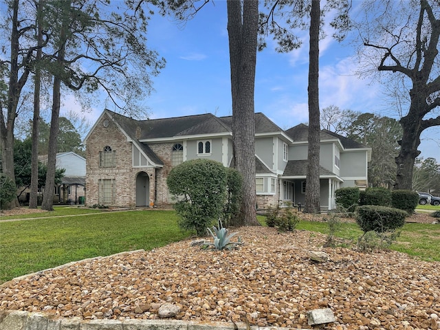 17439 Fairway Oaks Dr, Spring, TX 77379 - view of front of home featuring a front lawn, stucco siding, a shingled roof, brick siding, and stone siding